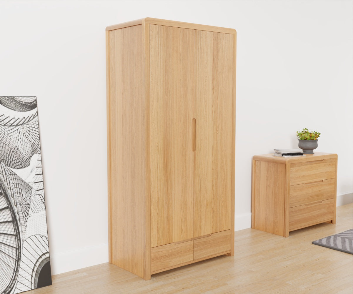Julian Bowen Curve 2 Door Wardrobe has 2 doors and 1 drawer at the bottom. Angled front view.