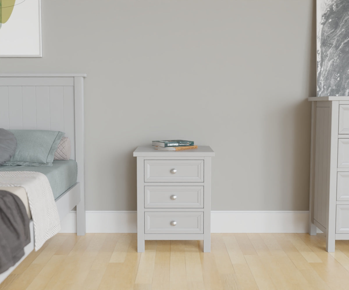 Maine 3 Drawer Beside Chest in grey has 3 drawers. This lifestyle image features other products from the Julian Bowen Maine range.