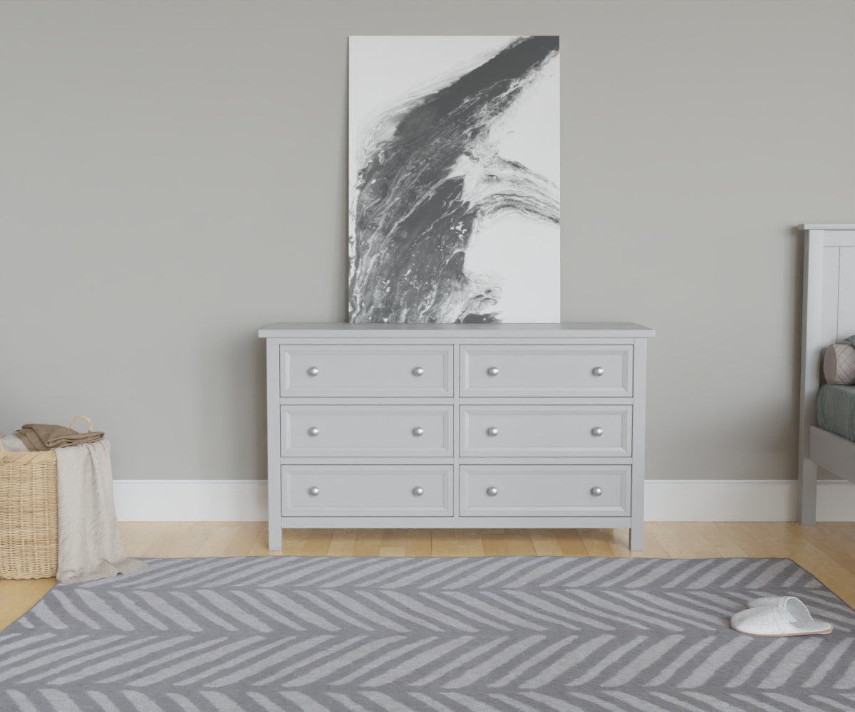 Maine 6 Drawer Chest in Grey has a square-edged top, with 6 equal drawers in two columns. This lifestyle image features other products from the Julian Bowen Maine range.