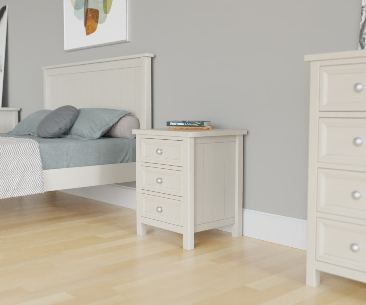 Maine 3 Drawer Beside Chest in grey has 3 drawers. This lifestyle image features other products from the Julian Bowen Maine range.