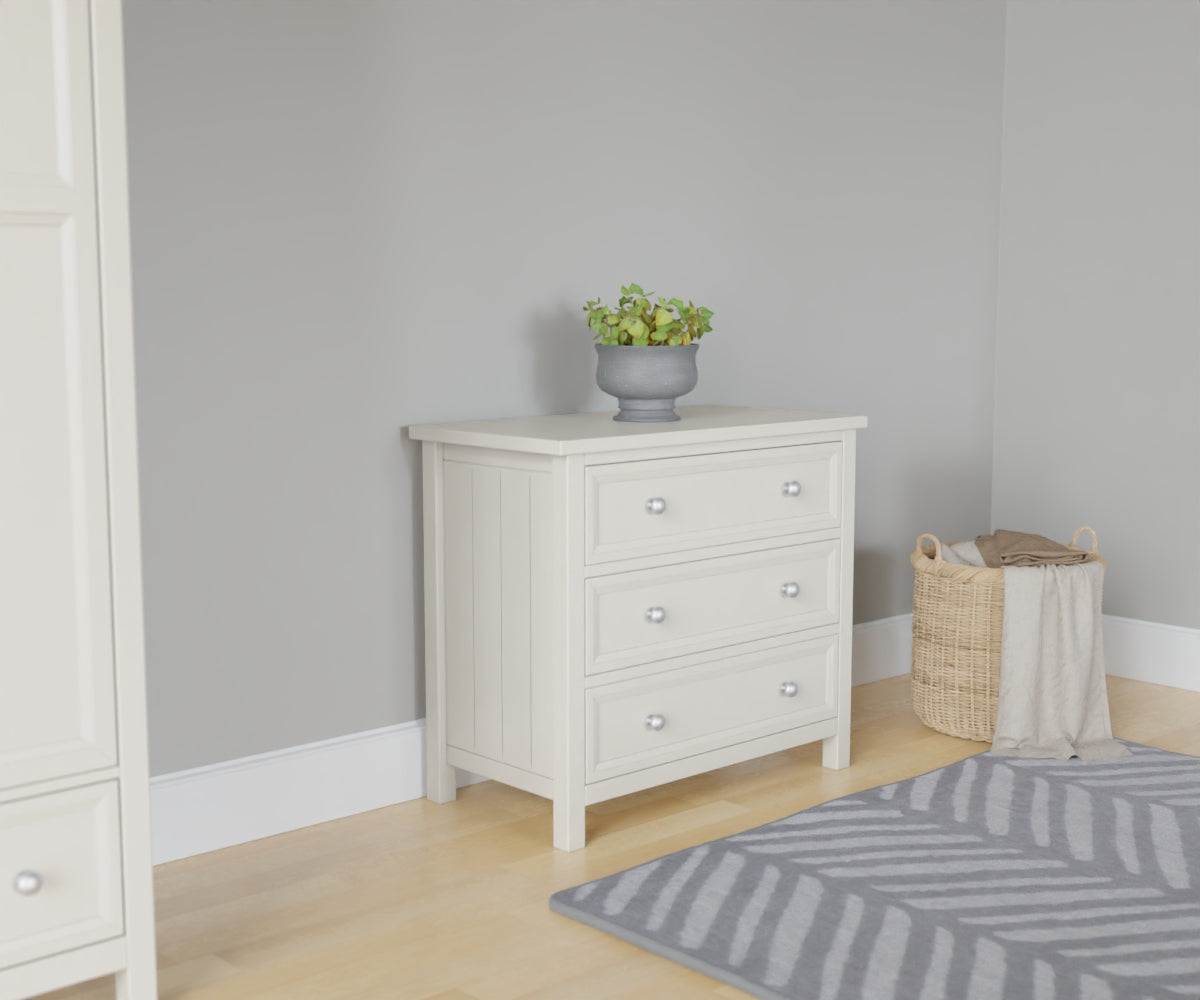 Maine 3 Drawer Chest in white has 3 wide drawers. This lifestyle image features other products from the Julian Bowen Maine range.