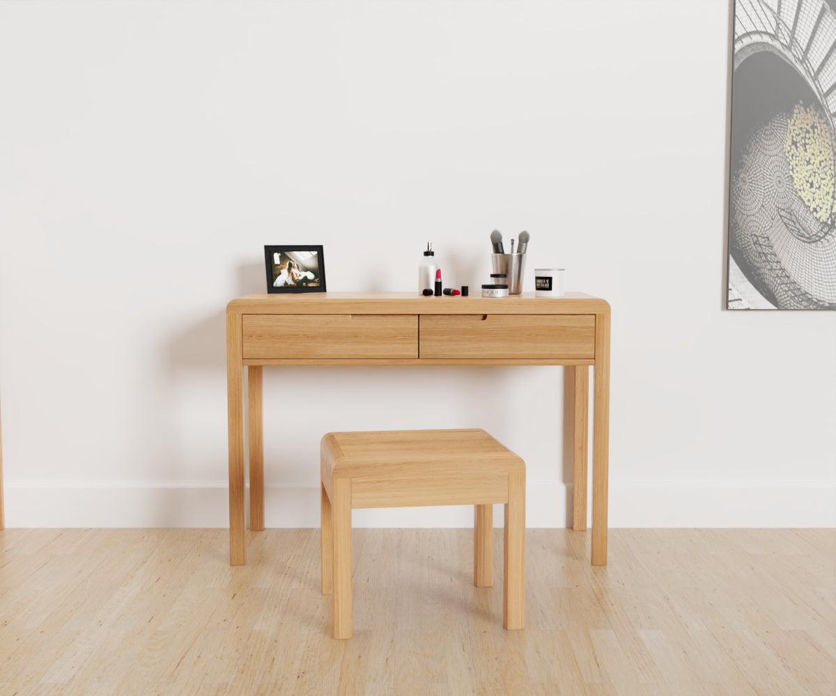 Julian Bowen Curve Dressing Table & Stool. Front view with makeup items on the table.