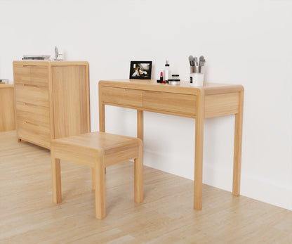 Julian Bowen Curve Dressing Table & Stool. Angled front view with other products from the range visible in the background.