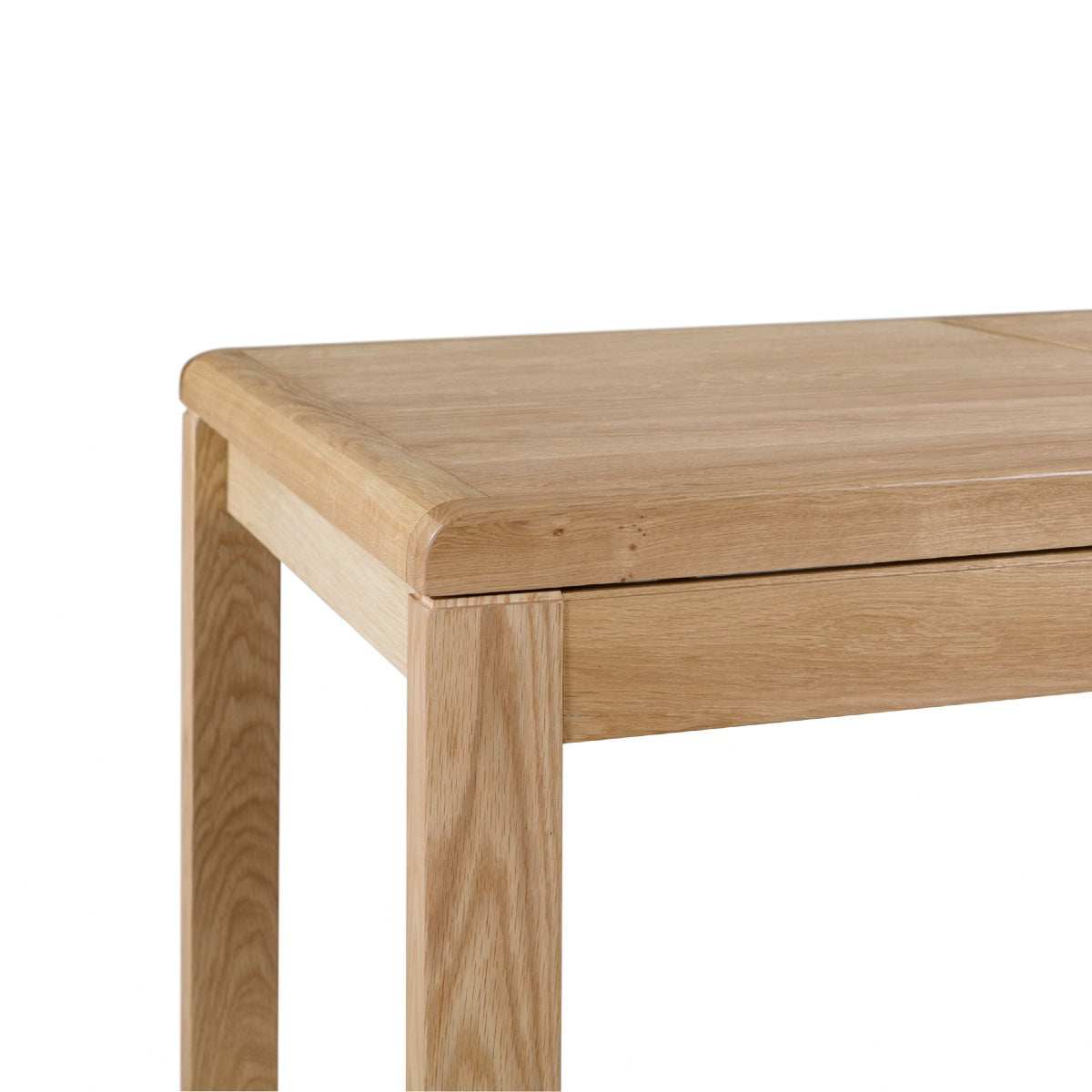 Julian Bowen Curve Oak Dining Table. Angled corner close-up cut-out image on a white background.