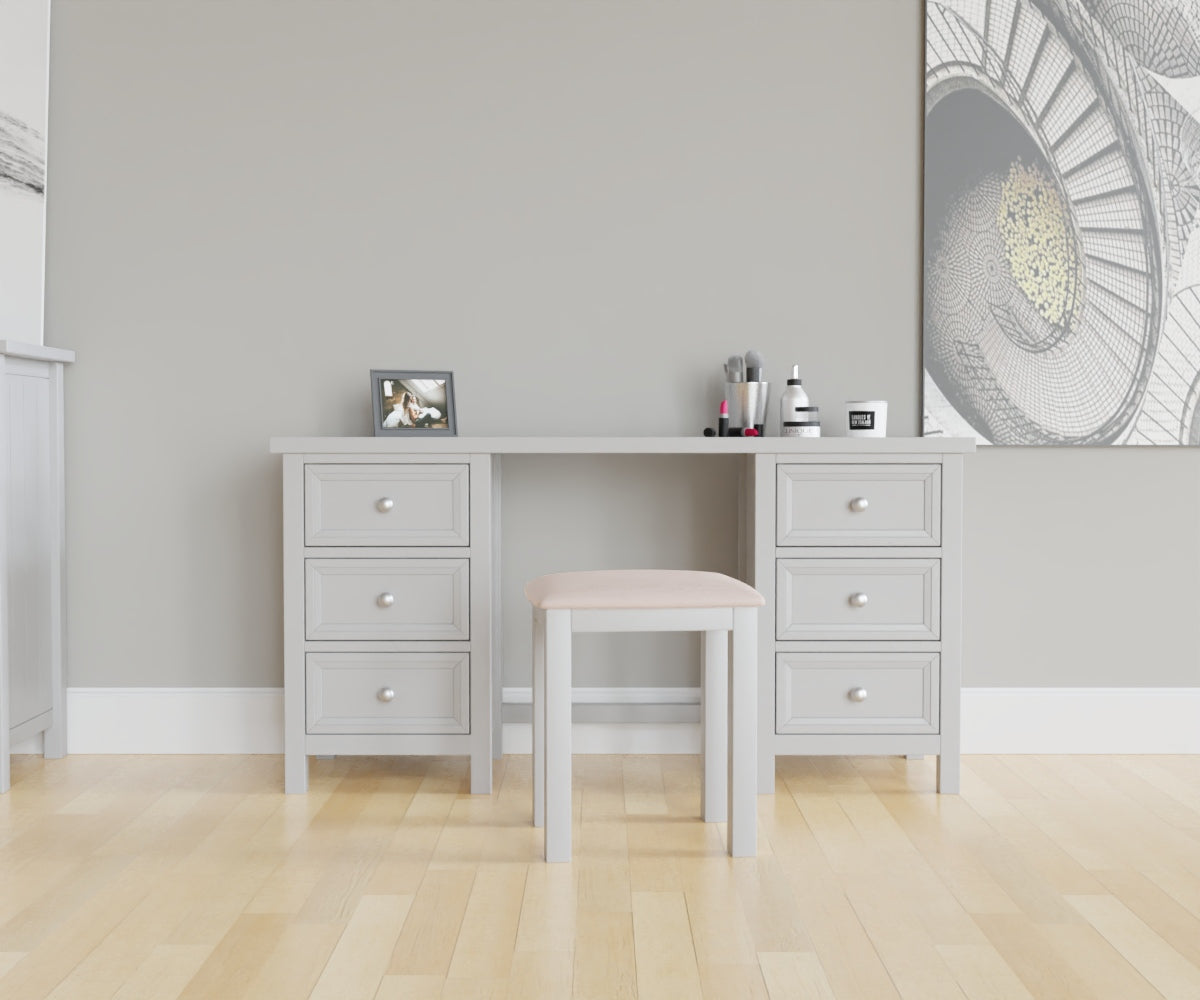 Maine Dressing Table in grey has a square-edged top, with 3 vertical drawer at both ends. This lifestyle image features other products from the Julian Bowen Maine range.