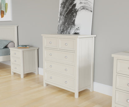 Maine 3 + 2 Drawer Chest in white has 3 wide drawers with 2 smaller drawers above. This lifestyle image features other products from the Julian Bowen Maine range.